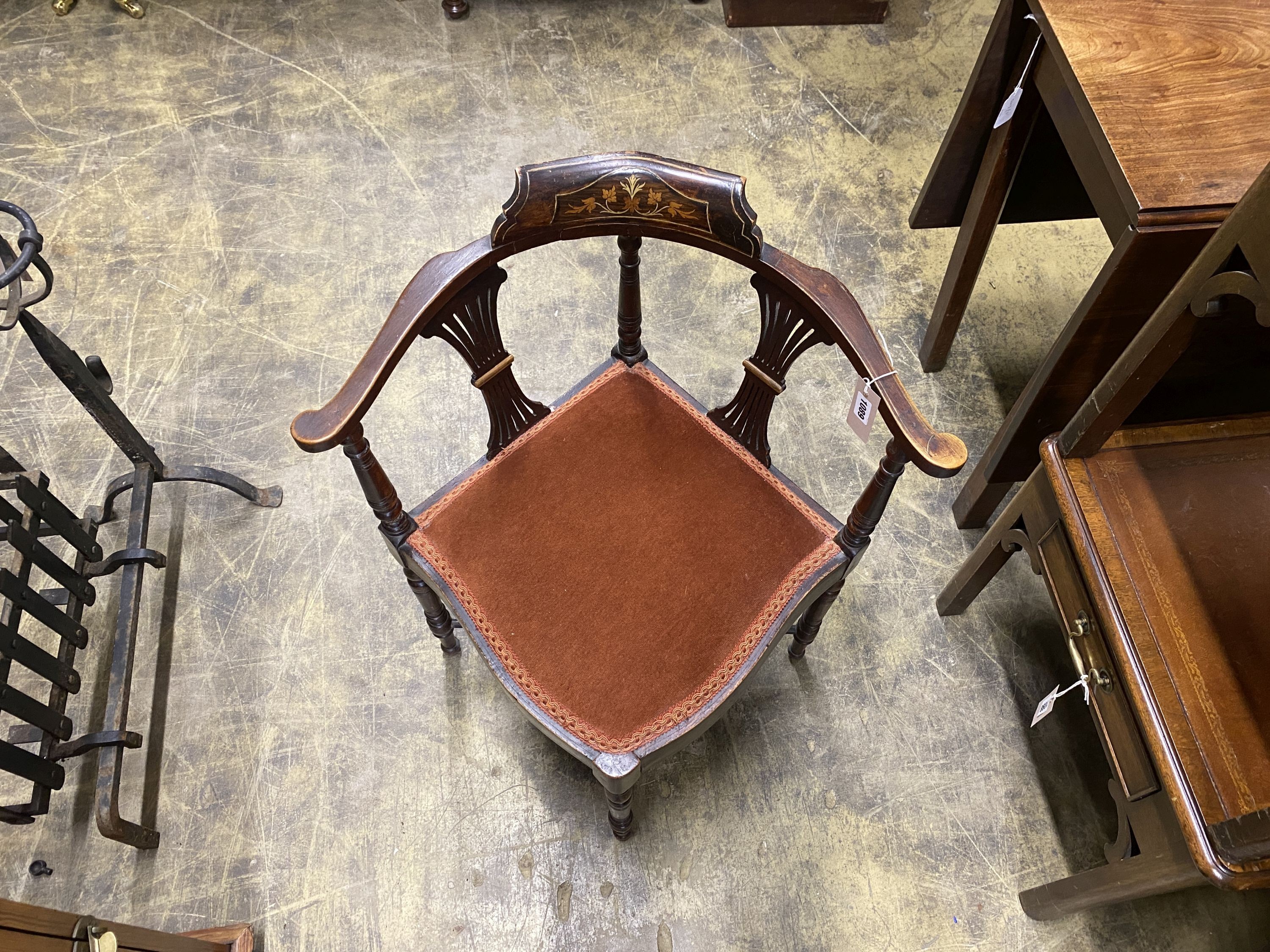 An Edwardian inlaid mahogany corner elbow chair